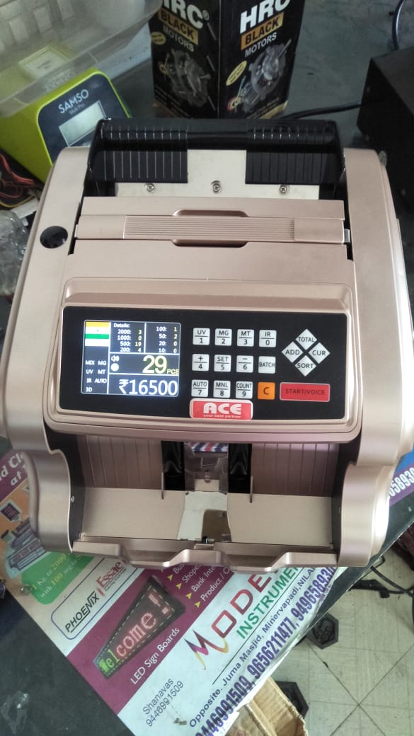 MODERN WEIGHING SCALE & CURRENCY COUNTERS